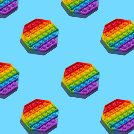 Anti-stress toy on a blue background, pattern. Trend, backgroundの写真素材