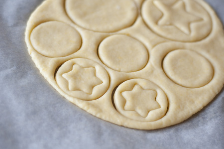Cooking homemade Christmas cookies. Cutting out dough.の写真素材