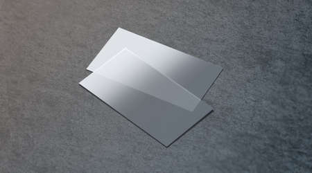 Blank plastic transparent business card mock up, 3d rendering. Clear pvc namecard mockup on textured surface. Empty acrylic horizontal customer pasteboard template for your logo presentation.の写真素材