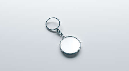 Blank metal round white key chain mock up isometric view, 3d rendering. Clear silver circular keychain design mockup isolated. Empty plain keyring souvenir holder template. Steel circle trinket labelの写真素材