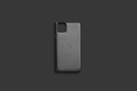Blank black phone case mock up, top view, dark backgroundの写真素材