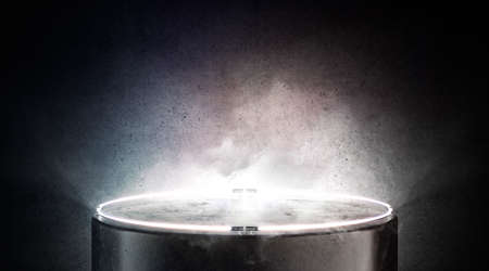 Blank black round glowing pedestal mockup on colored backgroundの写真素材