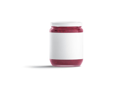 Blank glass jar with white label and berry jam mockup