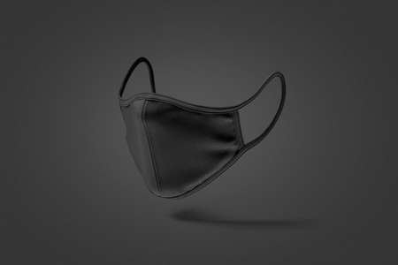 Blank black fabric face mask mock up, dark backgroundの写真素材