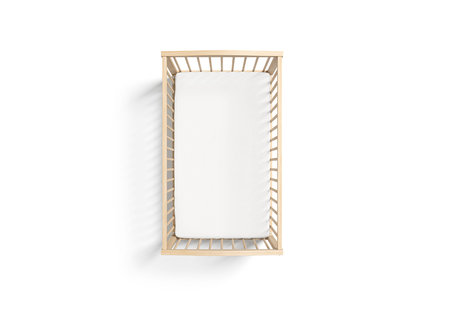 Blank wood cot with white crib sheet mockup, top view