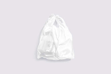 Blank white full t-shirt plastic bag mockup, gray backgroundの写真素材