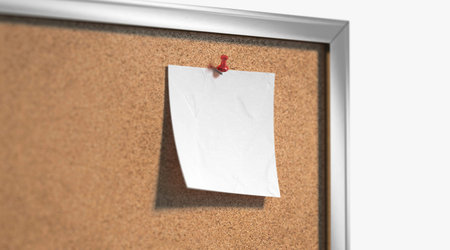 Blank white paper note pinned cork-board mockup, depth of field