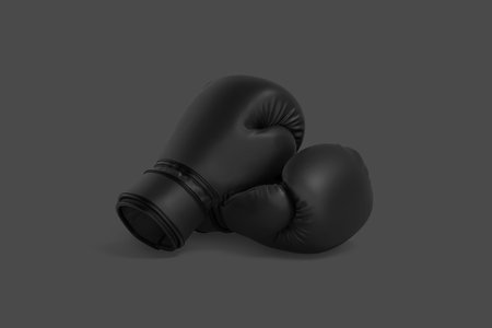 Blank black boxing gloves pair mockup lying, dark background