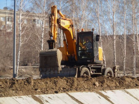 Kazakhstan, Ust-Kamenogorsk, April 11, 2019: Hyundai excavator at the construction site. Excavator works at a construction siteのeditorial素材