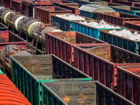 Freight wagons on railway station. Cargo terminal. Industrial background. Empty wagons. Wagons with goodsのeditorial素材
