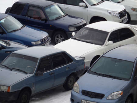 Kazakhstan, Ust-Kamenogorsk, February 16, 2019: Lots of cars in the parking lot, chaotic parking. Automotive backgroundのeditorial素材