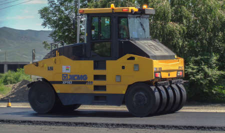 Kazakhstan, Ust-Kamenogorsk, June 21, 2019: Pneumatic roller XCMG XP 163. Steamroller. Equipment for construction and repair roads. Road roller machine rolls asphalt. Road under constructionのeditorial素材