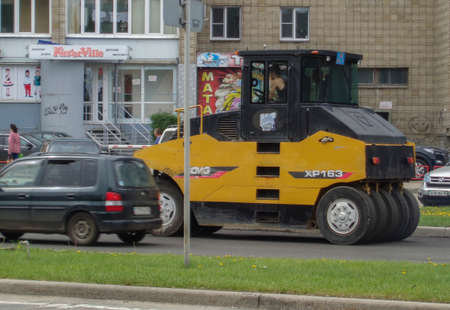 Kazakhstan, Ust-Kamenogorsk, may 22, 2019: Steamroller. Equipment for construction and repair roads. Yellow steamroller on the streetのeditorial素材