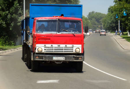 Kazakhstan, Ust-Kamenogorsk, June 26, 2019: Red Kamaz 5320. Old soviet truck. Blue. Cityscapeのeditorial素材