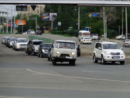 Kazakhstan, Ust-Kamenogorsk, August 9, 2019: Traffic. One of the city streets. Downtown. Street traffic. Urban landscape. Broken carのeditorial素材