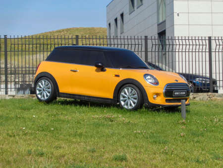 Kazakhstan, Ust-Kamenogorsk, july 18, 2019: Mini Cooper 3 Door (Advertising model). Bright yellow carのeditorial素材