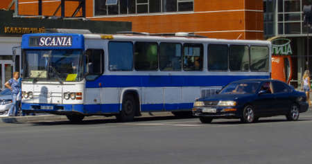 Kazakhstan, Ust-Kamenogorsk, August 10, 2019: Scania CN113. Old bus on one of the city streets. Urban landscapeのeditorial素材