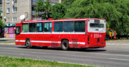 Kazakhstan, Ust-Kamenogorsk, july 8, 2019: Scania CN112CL. Red old bus on one of the city streets. Old bus. Scania bus. Red scaniaのeditorial素材