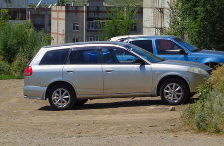 Cars parked near a residential building. Urban landscape. Outskirts. Ust-Kamenogorsk (Kazakhstan)のeditorial素材