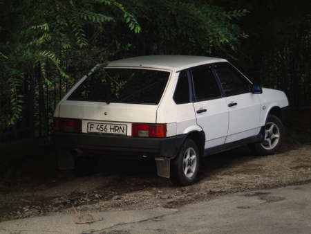 Kazakhstan, Ust-Kamenogorsk, August 22, 2019: Lada Samara (Vaz 2109, Lada Sputnik). Old car. Grunge. Green treesのeditorial素材
