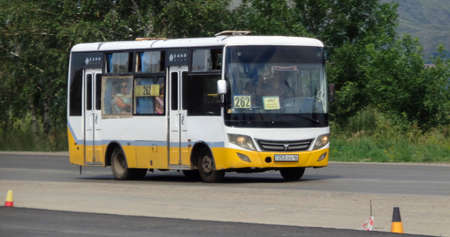 Kazakhstan, Ust-kamenogorsk, july 7, 2019: Small city bus on one of the city streets. Public transportのeditorial素材