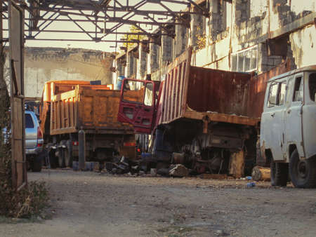 Abandoned trucks in an old ruined building. Ust-Kamenogorsk (Kazakhstan). Commercial vehiclesのeditorial素材