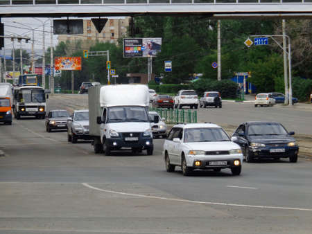 Kazakhstan, Ust-Kamenogorsk, August 9, 2019: Traffic. One of the city streets. Downtown. Street traffic. Urban landscape. Carsのeditorial素材