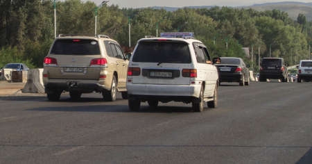 Kazakhstan, Ust-Kamenogorsk, august 16, 2019: Traffic on one of the streets of the city. Bridgeのeditorial素材