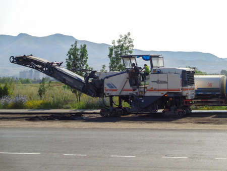 Kazakhstan, Ust-Kamenogorsk, july 18, 2019: Cold milling machines Wirtgen. Road works. Pavement milling. Road repairのeditorial素材