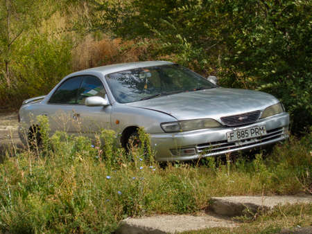 Kazakhstan, Ust-Kamenogorsk, September 10, 2019: Toyota Carina ED. Old japanese car. Car parked in grassのeditorial素材