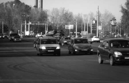 Kazakhstan, Ust-Kamenogorsk, September 10, 2019: Traffic. One of the city streets. Street traffic. Black and whiteのeditorial素材