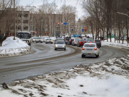 Kazakhstan, Ust-Kamenogorsk, february 6, 2020: Traffic. One of the city streets. Winter snow. Street trafficのeditorial素材