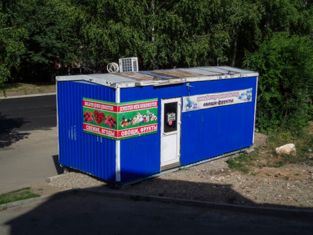 Kazakhstan, Ust-Kamenogorsk, 4 july, 2020: Vegetable and fruit stall. Small Shop. Green treesのeditorial素材