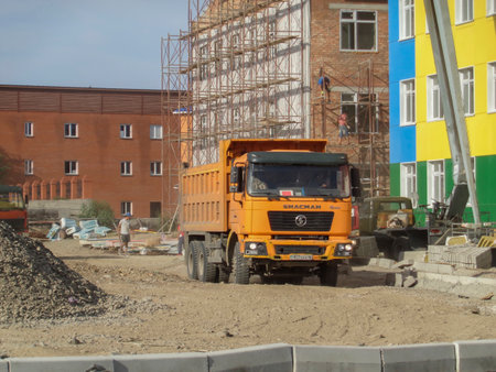 Kazakhstan, Ust-Kamenogorsk, august 11, 2020: Construction site. New kindergarten. Modern architecture. Construction engineering. Shacman F2000のeditorial素材