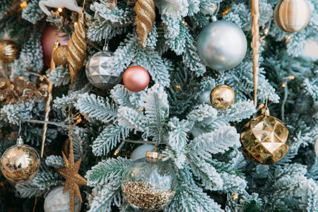 Close-up of a New Year's dora on Christmas tree branches: balls, toys, decorations