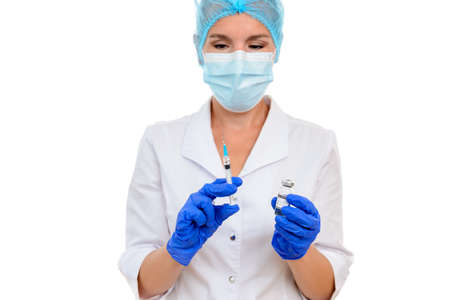 Nurse or doctor preparing a dose of covid-19 vaccine for vaccination, coronavirus vaccination concept. White isolated backgroundの写真素材