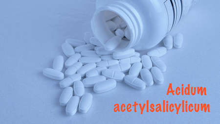 Acidum acetylsalicylicum - to strengthen bone tissue in the elderly, a can of white plastic, on a white backgroundの写真素材