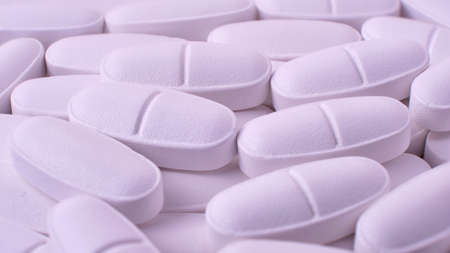 multivitamin in tablets - to strengthen bone tissue in the elderly, macro, backgroundの写真素材