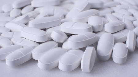 multivitamin in tablets - to strengthen bone tissue in the elderly, macro, backgroundの写真素材