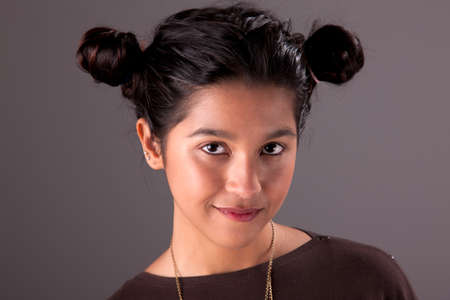 Young and attractive woman looking to camera, studio shotの写真素材