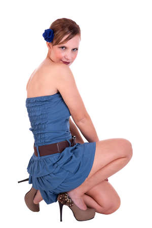 beautiful and happy middle-aged woman, in a blue dress, isolated on white background, studio shotの写真素材