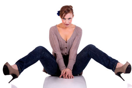 beautiful and happy middle-aged woman, sitting on the floor, isolated on white background, with  shadow, studio shotの写真素材