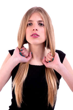 Beautiful woman  with hands holding the hair, looking to camera, isolated on whiteの写真素材