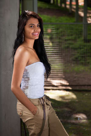 beautiful and happy latin woman, on a park, in outsideの写真素材