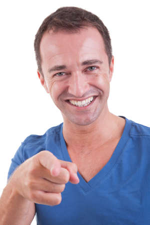 Portrait of a handsome middle-age man, pointing and laughing, very happy, on white background. Studio shotの写真素材