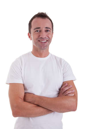 Portrait of a handsome middle-age man smiling, with arms crossed on white background. Studio shotの写真素材