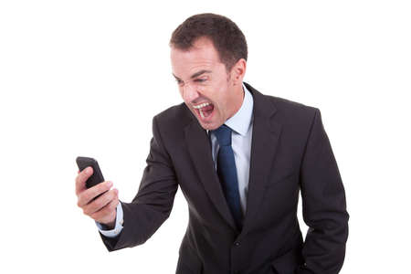 businessman sreaming on the phone, isolated on white backgroundの写真素材