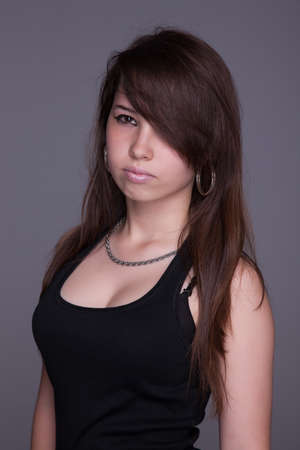 serious beautiful woman, looking up, studio shotの写真素材