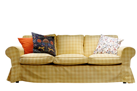 sofa covered with fabric light-brown cell isolated Three different-colored pillows on a white backgroundの写真素材