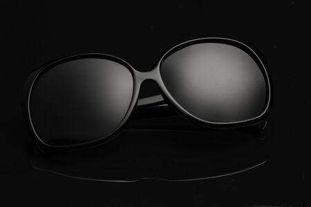 Sunglasses on the black backgroundの写真素材